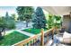 Relaxing front porch view of a tree-lined street at 3061 S Grant St, Englewood, CO 80113