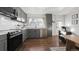 Modern kitchen with gray cabinets, stainless steel appliances, and a functional layout at 3061 S Grant St, Englewood, CO 80113