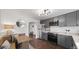 Modern kitchen with gray cabinets, stainless steel appliances, and breakfast nook at 3061 S Grant St, Englewood, CO 80113