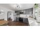 Updated kitchen featuring gray cabinets, stainless steel appliances, and an eat-in area at 3061 S Grant St, Englewood, CO 80113