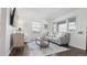 Living room with hardwood floors, neutral decor, and natural light at 3061 S Grant St, Englewood, CO 80113