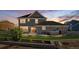 Landscaped backyard with a hot tub, patio, and grassy area perfect for outdoor entertaining and relaxation at 9515 E 109Th Cir, Commerce City, CO 80640