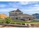 Gray home showcasing a backyard patio with a hot tub and well-maintained landscaping at 9515 E 109Th Cir, Commerce City, CO 80640