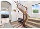 Inviting home entryway featuring a staircase with wooden banisters, a shoe rack, and hardwood floors at 9515 E 109Th Cir, Commerce City, CO 80640