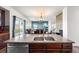 Open floor plan featuring a kitchen island with a stainless steel sink overlooking the living area at 9515 E 109Th Cir, Commerce City, CO 80640