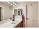 Simple bathroom with a single sink, white countertop, and adequate lighting at 7452 S Utica St, Littleton, CO 80128