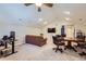 Spacious bonus room features a vaulted ceiling, home office and a seating area with a TV at 7452 S Utica St, Littleton, CO 80128