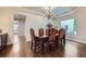 Formal dining room with elegant chandelier, ornate table set, and sky-painted ceiling at 7452 S Utica St, Littleton, CO 80128