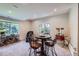 Game room featuring a table, movie-style popcorn maker, and wrought iron wine rack at 7452 S Utica St, Littleton, CO 80128