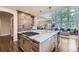 Gourmet kitchen with a large island, stainless steel appliances, and eat in bar at 7452 S Utica St, Littleton, CO 80128