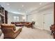 Living room featuring a comfortable sofa, neutral walls and carpet, and great recessed lighting at 7452 S Utica St, Littleton, CO 80128
