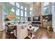 Bright living room featuring a wall of windows, fireplace, and modern furnishings at 7452 S Utica St, Littleton, CO 80128