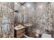 Striking powder room with unique textured walls, vessel sink, and modern fixtures at 7452 S Utica St, Littleton, CO 80128