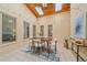 Bright dining room with wood ceiling, skylights, and a modern table set for elegant meals at 31 Irene Ct, Broomfield, CO 80020