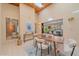 Sunlit dining room boasts a wooden ceiling, modern furnishings, and an open view to the main dining area at 31 Irene Ct, Broomfield, CO 80020