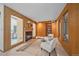 Cozy living room featuring a wood-paneled accent wall, inviting fireplace, and comfortable seating for relaxation at 31 Irene Ct, Broomfield, CO 80020