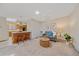 Bright living room with neutral decor, ceiling fan, and seamless access to the adjacent kitchen and dining area at 31 Irene Ct, Broomfield, CO 80020
