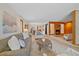Expansive living room with a cozy fireplace, adjoining dining area, and an open floor plan perfect for gatherings at 31 Irene Ct, Broomfield, CO 80020