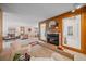 Spacious open-concept living room with cozy fireplace, ample seating, and seamless flow to the dining area at 31 Irene Ct, Broomfield, CO 80020
