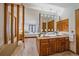 View of the main bathroom featuring a double sink vanity, bathtub, and an open floorplan leading to main bedroom at 31 Irene Ct, Broomfield, CO 80020