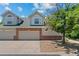 Charming townhome with a two-car garage and inviting curb appeal in a desirable neighborhood at 12502 E Harvard Cir, Aurora, CO 80014