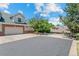 Spacious driveway and well-maintained exterior of a charming townhome on a sunny day at 12502 E Harvard Cir, Aurora, CO 80014
