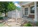 Close-up showcasing the inviting front entrance, complete with a stylish security door and manicured landscape at 12502 E Harvard Cir, Aurora, CO 80014