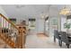 Sunlit living room with fireplace, open floor plan, hardwood entry and stylish decor at 12502 E Harvard Cir, Aurora, CO 80014