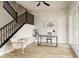 Bright office space featuring hardwood floors and a modern ceiling fan at 6303 Elmira St, Denver, CO 80238