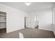 Spacious bedroom with neutral carpet, walk-in closet, and bright white trim at 5584 Moosehead Cir, Longmont, CO 80504