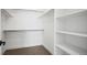 Walk-in closet with shelving and hanging rods for optimal storage at 5584 Moosehead Cir, Longmont, CO 80504
