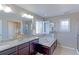 Luxurious bathroom featuring double vanity, soaking tub, and a separate shower at 16021 Williams Pl, Broomfield, CO 80023