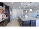 Bright kitchen featuring a large island with seating, stainless steel appliances, and ample cabinet space at 16021 Williams Pl, Broomfield, CO 80023