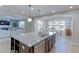 Spacious kitchen with an island, perfect for Gathering gatherings and entertaining, that opens into the dining and living areas at 16021 Williams Pl, Broomfield, CO 80023