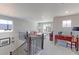 Spacious loft area with staircase, ample natural light, and comfortable furnishings at 16021 Williams Pl, Broomfield, CO 80023