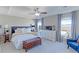 Serene main bedroom with tray ceiling, plush bedding, and soft natural lighting at 16021 Williams Pl, Broomfield, CO 80023