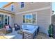 Outdoor patio with comfortable seating, a wooden privacy screen, and a lovely view of the backyard at 16021 Williams Pl, Broomfield, CO 80023