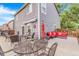 Backyard patio with multiple seating areas and outdoor decor for relaxing and entertaining at 5320 E 100Th Dr, Thornton, CO 80229