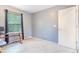 Bedroom with a bright window offering natural light and ample space for a desk at 5320 E 100Th Dr, Thornton, CO 80229