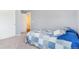 Neutral colored bedroom, featuring a large bed and closet, with view to the hallway at 5320 E 100Th Dr, Thornton, CO 80229