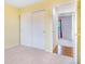 Bedroom with sliding closet doors and neutral carpeting provides ample storage at 5320 E 100Th Dr, Thornton, CO 80229