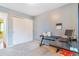Bedroom has a large desk area, big closet, and neutral paint and carpeting at 5320 E 100Th Dr, Thornton, CO 80229