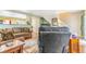 View of living room with wood floor and stylish sofa, also view of entryway and stairs to second story at 5320 E 100Th Dr, Thornton, CO 80229