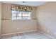 Finished basement bedroom with neutral walls, carpet floors, and a window view at 29 Woodland Cir, Highlands Ranch, CO 80126