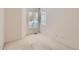 Bright bedroom featuring neutral walls, a window with tree views and carpet floors at 29 Woodland Cir, Highlands Ranch, CO 80126