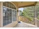 Partially covered patio with views of backyard, landscaping, and decorative outdoor planters at 29 Woodland Cir, Highlands Ranch, CO 80126