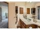 Bathroom with double vanity and decorative shelving at 1240 S Idalia St, Aurora, CO 80017