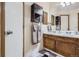 Bathroom features a double sink vanity and built in shelving at 1240 S Idalia St, Aurora, CO 80017