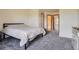 Bedroom with neutral colored carpet and view to bathroom at 1240 S Idalia St, Aurora, CO 80017