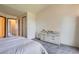 Bedroom featuring neutral carpet, ceiling and walls with dresser at 1240 S Idalia St, Aurora, CO 80017